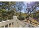 Stairway overlooks backyard, showing tree canopy and serene setting at 2356 Hut Creek Rd, Johns Island, SC 29455