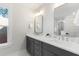 This bathroom features a double sink vanity with white quartz countertops and sleek, modern fixtures at 2356 Hut Creek Rd, Johns Island, SC 29455