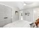 Cozy bedroom featuring a comfortable bed, closet doors, and a view to a hallway at 2356 Hut Creek Rd, Johns Island, SC 29455