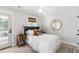 Inviting bedroom with a large bed, a ceiling fan, and a door leading to a balcony at 2356 Hut Creek Rd, Johns Island, SC 29455
