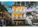 Stunning three-story home with multiple balconies and a classic coastal design at 2356 Hut Creek Rd, Johns Island, SC 29455