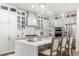 Modern kitchen with stainless steel appliances, spacious center island with chairs and modern lighting at 2356 Hut Creek Rd, Johns Island, SC 29455