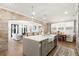 Open concept kitchen with a large island and pendant lighting at 2356 Hut Creek Rd, Johns Island, SC 29455