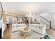 Bright, open-concept living room leading to a dining area and kitchen at 2356 Hut Creek Rd, Johns Island, SC 29455