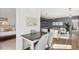 Open concept living room features hardwood floors and desk area. Bedroom is adjacent to the room at 2356 Hut Creek Rd, Johns Island, SC 29455