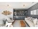 Living room with custom built-in shelving, modern decor, and a comfortable seating area at 2356 Hut Creek Rd, Johns Island, SC 29455