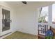 This covered porch has views to the outside and interior, seamlessly blending indoor and outdoor living at 2356 Hut Creek Rd, Johns Island, SC 29455