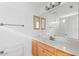 Bathroom featuring a wood vanity, neutral countertop, large mirror, and a shower/tub combination at 241 Howle Ave # G, Charleston, SC 29412
