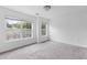 Bright, neutral bedroom featuring carpet, two windows for ample light, and light walls at 241 Howle Ave # G, Charleston, SC 29412