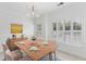 Elegant dining room with a modern chandelier and shuttered windows at 241 Howle Ave # G, Charleston, SC 29412