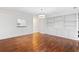 Spacious living room showcasing gleaming hardwood floors and custom built-ins at 241 Howle Ave # G, Charleston, SC 29412