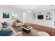 Cozy living room with built-in shelves and hardwood floors at 241 Howle Ave # G, Charleston, SC 29412