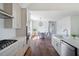 Bright kitchen featuring stainless appliances, a gas cooktop, and white cabinets with a tile backsplash at 2553 Hut Creek Rd, Johns Island, SC 29455