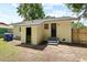 The backyard features access doors and a brick-paved area, perfect for outdoor activities and storage at 2704 Orchid Ave, North Charleston, SC 29405