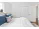Bedroom features hardwood floors, queen bed and large closet for storage at 2704 Orchid Ave, North Charleston, SC 29405