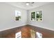 Bedroom with hardwood floors and two windows that provide ample natural light and a neighborhood view at 2704 Orchid Ave, North Charleston, SC 29405