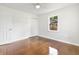 Bedroom featuring hardwood floors, a ceiling fan, closet, and a window for natural light and air circulation at 2704 Orchid Ave, North Charleston, SC 29405