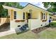 Charming home featuring fresh paint, custom wood shutters, and flower boxes creating inviting curb appeal at 2704 Orchid Ave, North Charleston, SC 29405