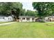 Charming home with a lush green lawn and charming shutters at 2704 Orchid Ave, North Charleston, SC 29405