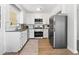 Well-appointed kitchen with white cabinets, stainless steel appliances, and granite countertops for a modern look at 2704 Orchid Ave, North Charleston, SC 29405