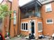 This home features a balcony overlooking the yard at 30 Society St, Charleston, SC 29401