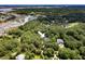 Overhead shot points to a charming home nestled among dense trees, near waterfront and golf course at 3171 Pignatelli Cres, Mount Pleasant, SC 29466