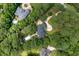 Aerial view of a beautiful home nestled in a lush wooded lot featuring a private pool and circular drive at 3171 Pignatelli Cres, Mount Pleasant, SC 29466