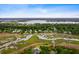Stunning aerial view capturing waterfront homes with private docks in a serene, marshy landscape under a blue sky at 3171 Pignatelli Cres, Mount Pleasant, SC 29466