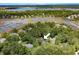 An aerial view showing beautiful homes nestled in a lush wooded lot surrounded by marsh and waterway at 3171 Pignatelli Cres, Mount Pleasant, SC 29466