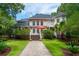 Expansive backyard featuring a manicured lawn, mature landscaping, and a charming stone pathway at 3171 Pignatelli Cres, Mount Pleasant, SC 29466