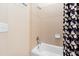 Bathroom features a white tub and shower with decorative tile surround at 3171 Pignatelli Cres, Mount Pleasant, SC 29466