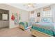 Bright bedroom with two twin beds featuring colorful bedding, window, and beach-themed decorations at 3171 Pignatelli Cres, Mount Pleasant, SC 29466