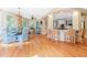 Bright breakfast nook featuring a glass-top table, upholstered chairs, and hardwood floors at 3171 Pignatelli Cres, Mount Pleasant, SC 29466