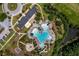 Aerial view showcasing the clubhouse and zero entry pool with water features, slide and lush landscaping at 3171 Pignatelli Cres, Mount Pleasant, SC 29466