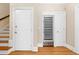 Hallway featuring a built-in wine cooler, a staircase, and two doors at 3171 Pignatelli Cres, Mount Pleasant, SC 29466