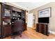 Traditional home office featuring a built-in desk, shelving, and rich wood accents with a charming area for entertainment at 3171 Pignatelli Cres, Mount Pleasant, SC 29466