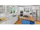 Well-lit kitchen with white cabinets, granite countertops, stainless steel appliances, and a blue island at 3171 Pignatelli Cres, Mount Pleasant, SC 29466