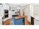 Modern kitchen with an island, white cabinetry, stainless appliances, and wood floors at 3171 Pignatelli Cres, Mount Pleasant, SC 29466