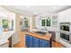 Open kitchen with granite counters, wood island, stainless appliances and hardwood floors at 3171 Pignatelli Cres, Mount Pleasant, SC 29466