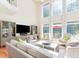 Bright living room with high ceilings, large windows, and comfortable seating at 3171 Pignatelli Cres, Mount Pleasant, SC 29466