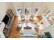 Areal view of living room with hardwood floors, tall windows, and neutral furniture at 3171 Pignatelli Cres, Mount Pleasant, SC 29466