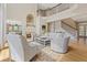 Bright living room with high ceilings, fireplace, hardwood floors, and second story landing at 3171 Pignatelli Cres, Mount Pleasant, SC 29466