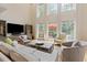 Bright living room with high ceilings, large windows, and comfortable seating at 3171 Pignatelli Cres, Mount Pleasant, SC 29466