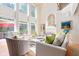 Bright living room with high ceilings, large windows, and comfortable seating arrangement at 3171 Pignatelli Cres, Mount Pleasant, SC 29466