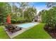 Serene backyard pool with comfortable lounge chairs, a lush lawn, and privacy landscaping at 3171 Pignatelli Cres, Mount Pleasant, SC 29466