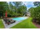 Inviting backyard pool with lounge seating, perfect for relaxation and outdoor enjoyment at 3171 Pignatelli Cres, Mount Pleasant, SC 29466