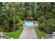 Gorgeous pool area with comfortable seating and tropical landscaping, an ideal outdoor retreat at 3171 Pignatelli Cres, Mount Pleasant, SC 29466