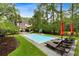 Private pool area surrounded by lush greenery, lounge chairs, and well-maintained lawn at 3171 Pignatelli Cres, Mount Pleasant, SC 29466