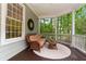 Cozy side porch with wicker seating, perfect for relaxing and enjoying the outdoors at 3171 Pignatelli Cres, Mount Pleasant, SC 29466
