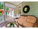 Inviting porch with comfortable wicker seating and stylish decor for outdoor relaxation at 3171 Pignatelli Cres, Mount Pleasant, SC 29466
